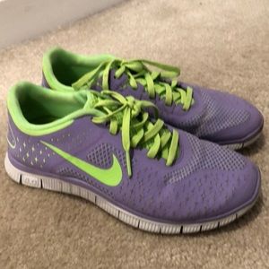 purple and green nike shoes